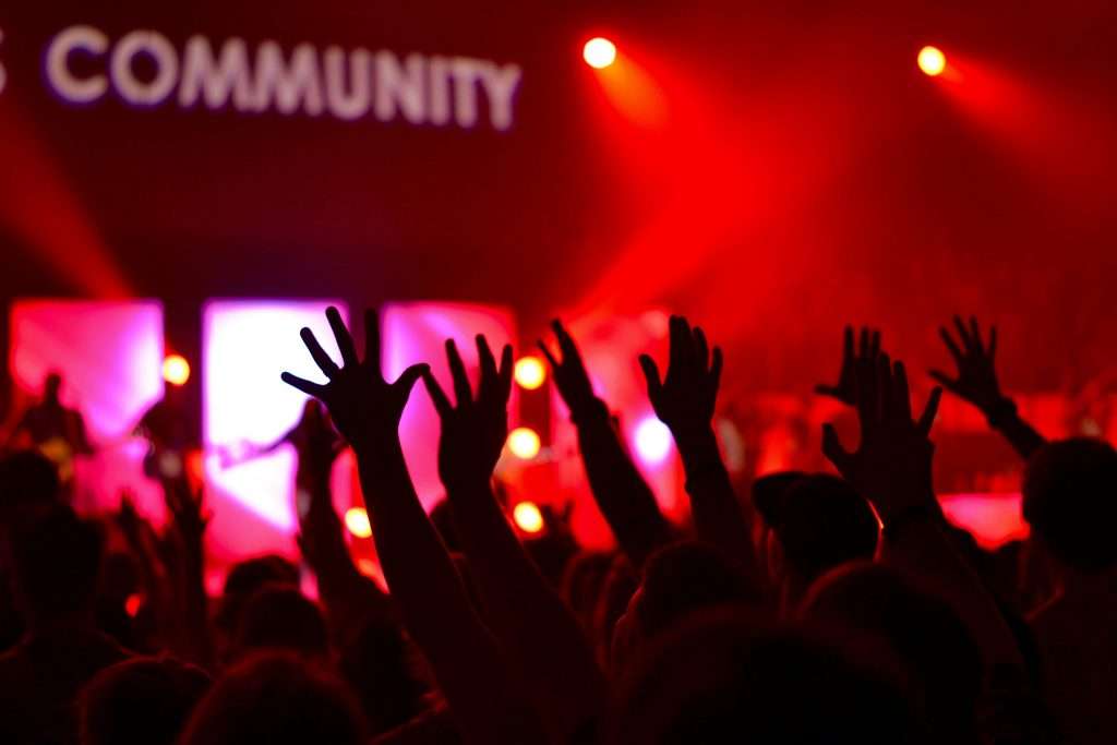 people raises hands — celebrating the culture of promise