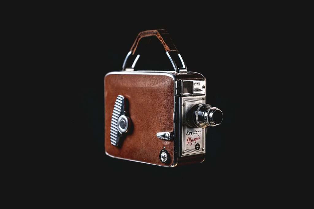 Vintage handheld movie camera to illustrate stoytelling and media production